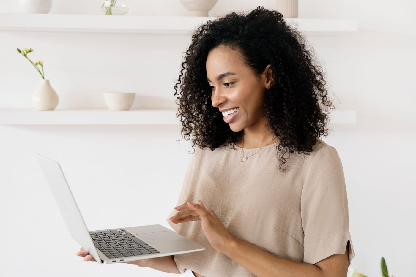 A creator setting up a paid channel from her laptop